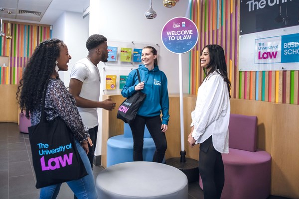 University of Law staff members talking to event attendees University of Law staff members talking to event attendees