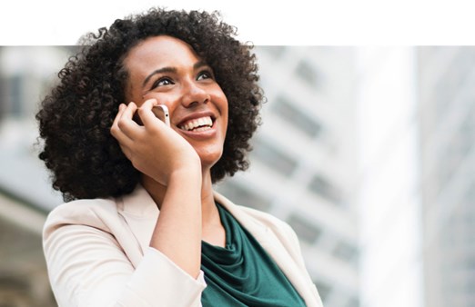 Smiling woman on her mobile 