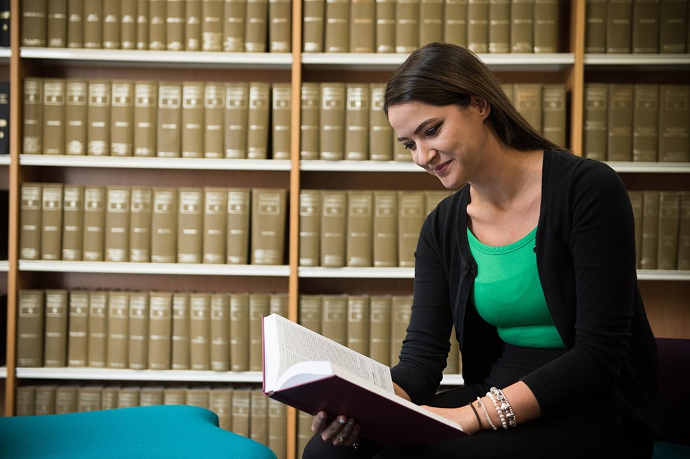 Student reading in library