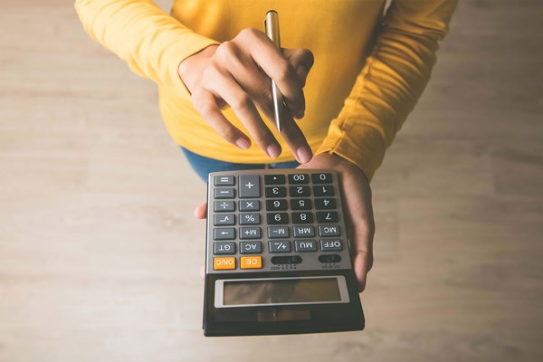 Person using calculator Person using calculator
