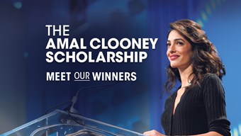 Image of Amal Clooney stood at a lectern with a blue background, and white text on the left of her picture that reads The Amal Clooney Scholarship, meet our winners.