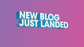 'New blog just landed' copy in large white writing against a pink background fading to purple